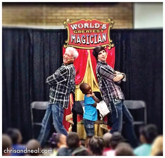 Magicians Chris and Neal in Raleigh, North Carolina posed with a child after their levitating act
