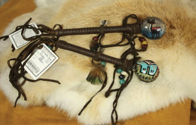 Rattle Sticks with Hand Painted Hide and buckskin wrapped Quartz Crystals on the handles. Lovely Navajo Made with Artists Certificate attached.