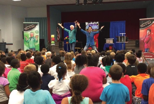 Magicians in Raleigh North Carolina performing incredible illusions to a captive crowd of energized children ready to be amazed by dynamic magic and illusions at their Rockingham library outside of Raleigh North Carolina