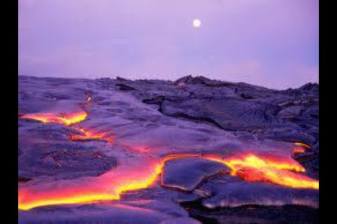 Pu'u O'o surface lava flow with the full moon rising in Hawaii Volcanoes National Park on the island of Hawaii