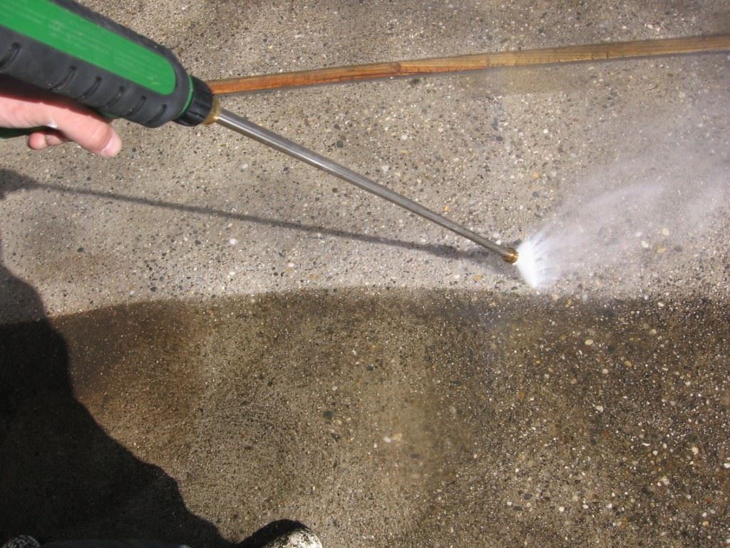 Pressure washing a concrete patio