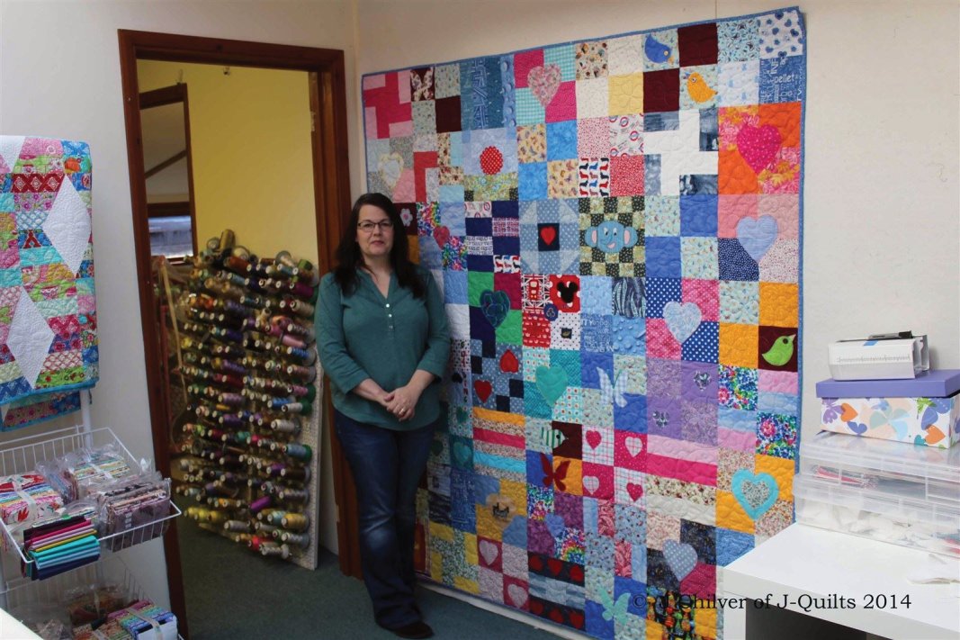 Me with the completed quilt in my studio
