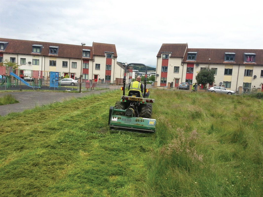 Housing estate open play area requiring flail cutting. Large overgrown grass areas are dealt with with our tractor and flail machine. This machine is ideal for virtually any overgrown grass area, paddocks, wild meadow clearance and general land clearing operations. Edinburgh, Midlothian, East Lothian, Fife and the Scottish Border regions