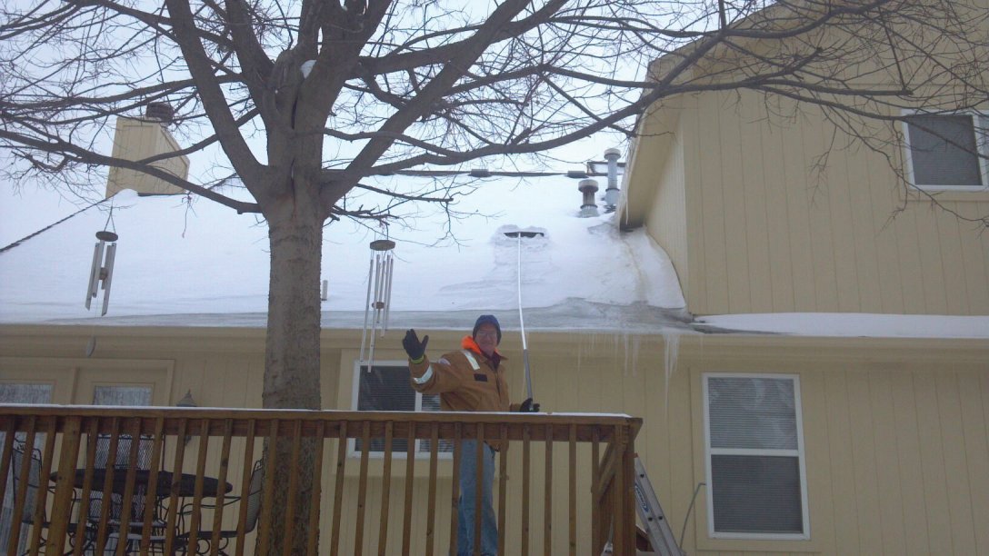 Friendly Roof Raking: Snow and ice dams build up putting pressure on your roof and gutters causinig damage and leaks.
