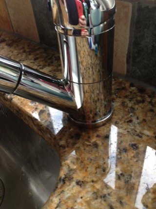 Limescale, water mark removal on granite worksurfaces. Legacy Deep Cleaning after